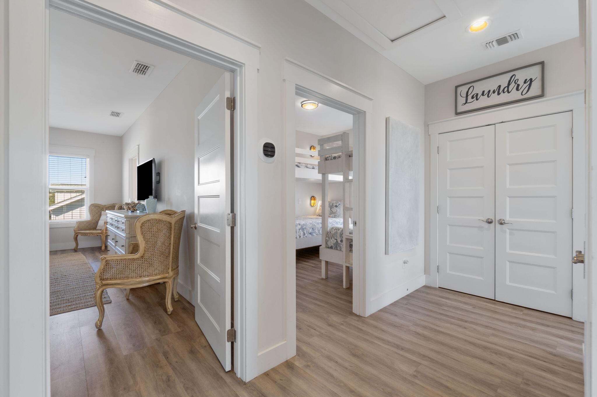 10 Blue Surf Lane Miramar Beach, FL 32550 - Photo 21 of 60 a view of a hallway with wooden floor windows and a livingroom