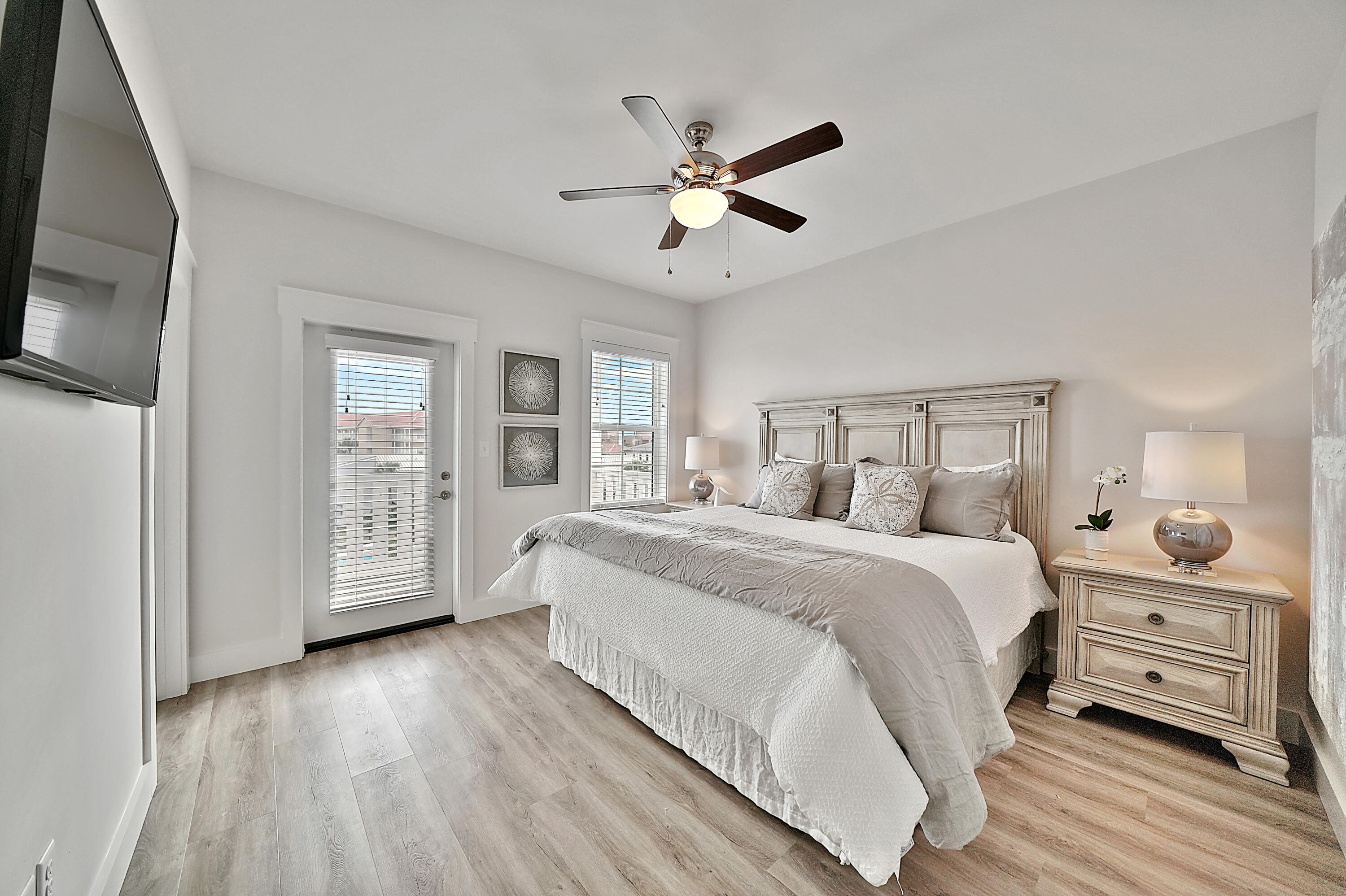 10 Blue Surf Lane Miramar Beach, FL 32550 - Photo 26 of 60 a bedroom with a bed and wooden floor