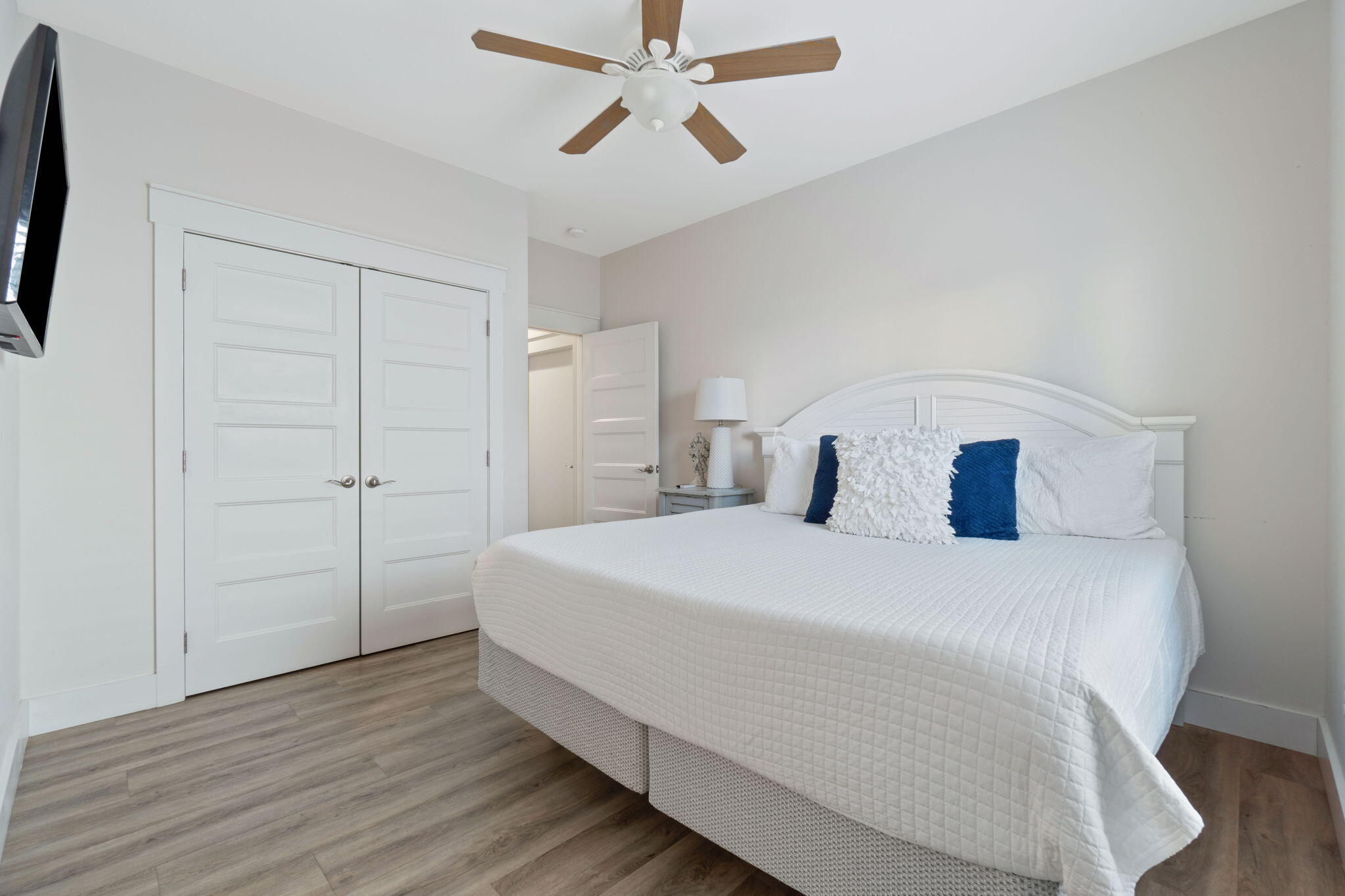 10 Blue Surf Lane Miramar Beach, FL 32550 - Photo 34 of 60 a bedroom with a bed and a chandelier