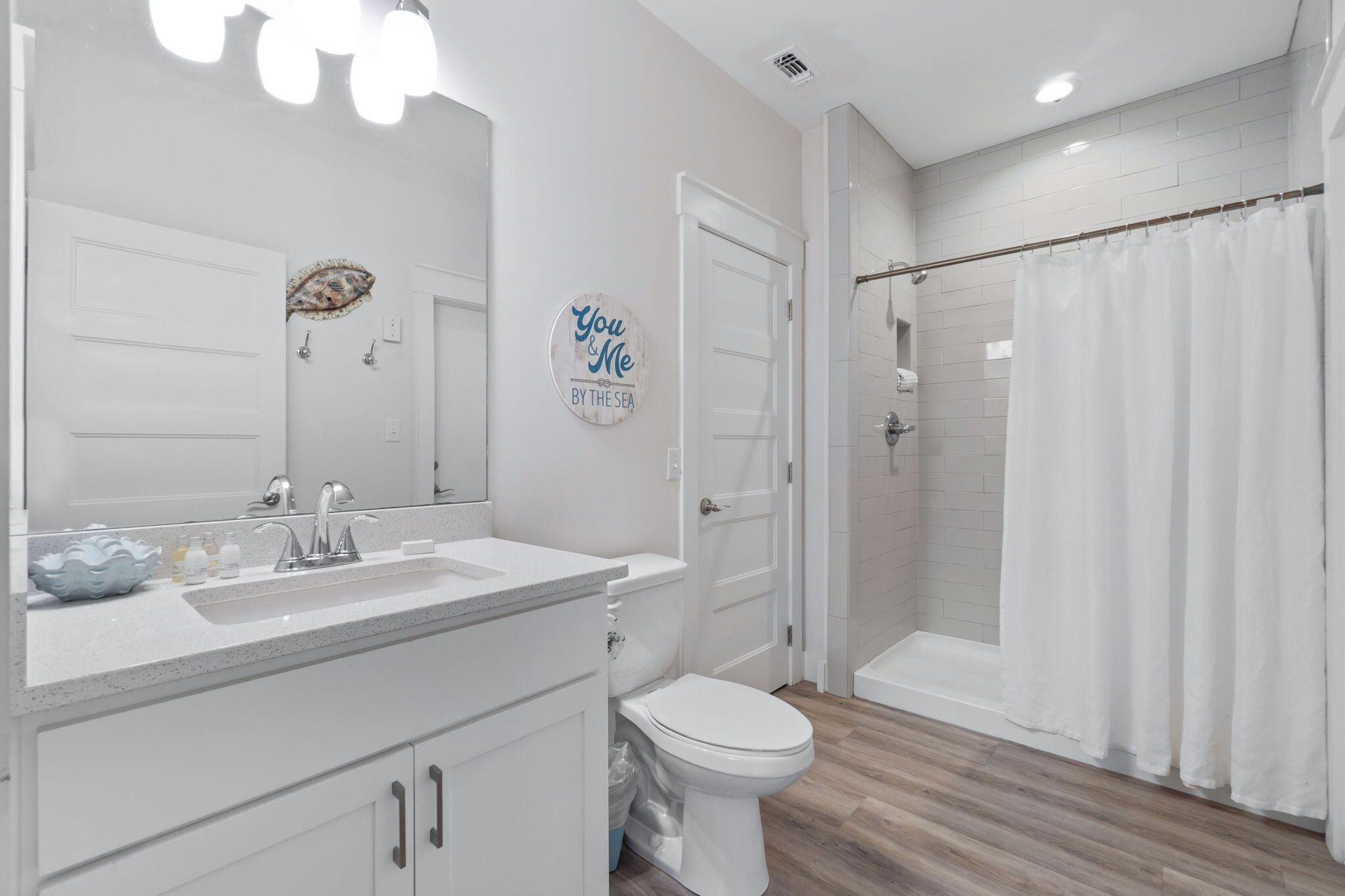 10 Blue Surf Lane Miramar Beach, FL 32550 - Photo 35 of 60 a bathroom with a sink a toilet and shower