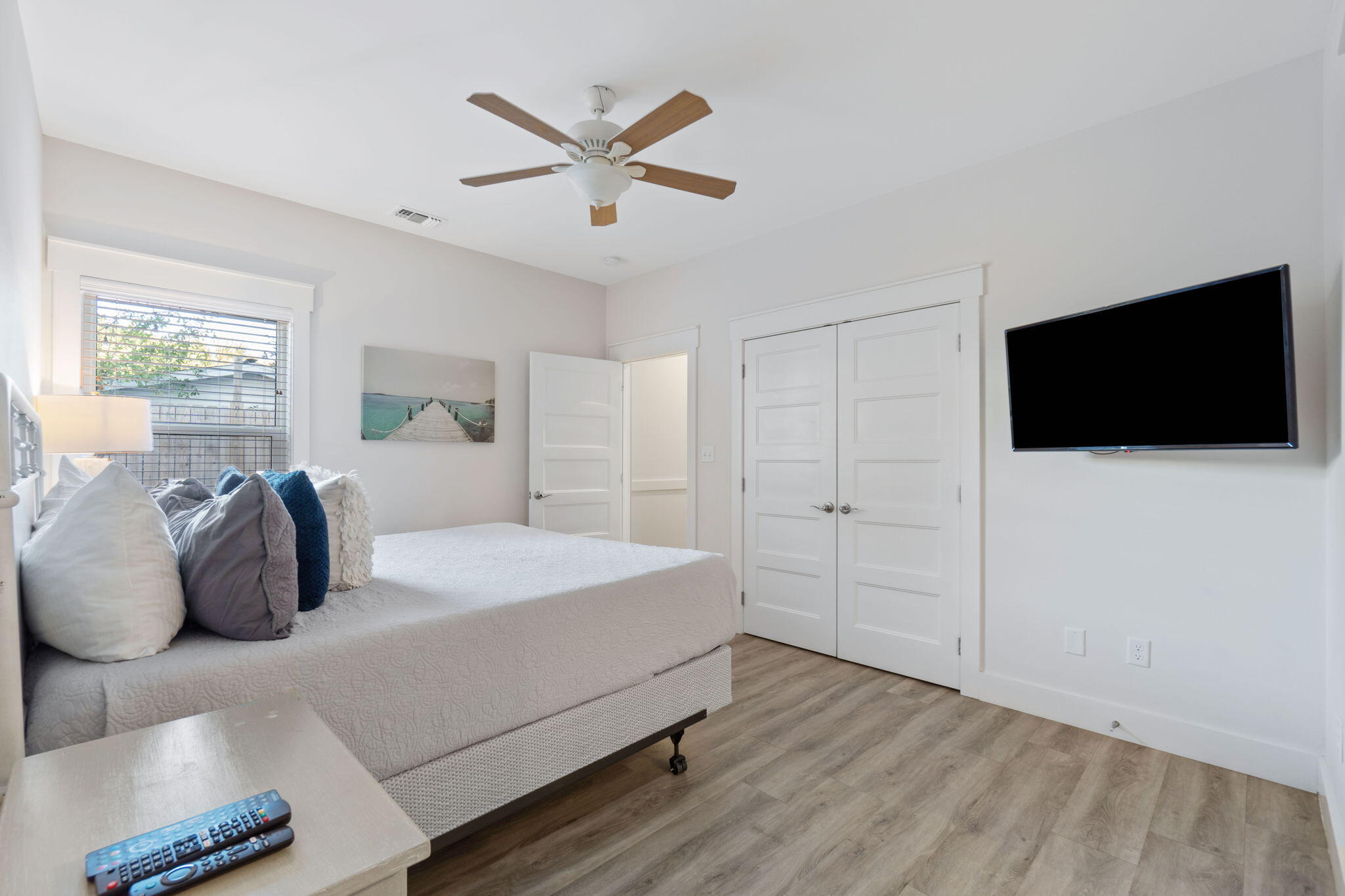 10 Blue Surf Lane Miramar Beach, FL 32550 - Photo 37 of 60 a spacious bedroom with a bed and a flat screen tv