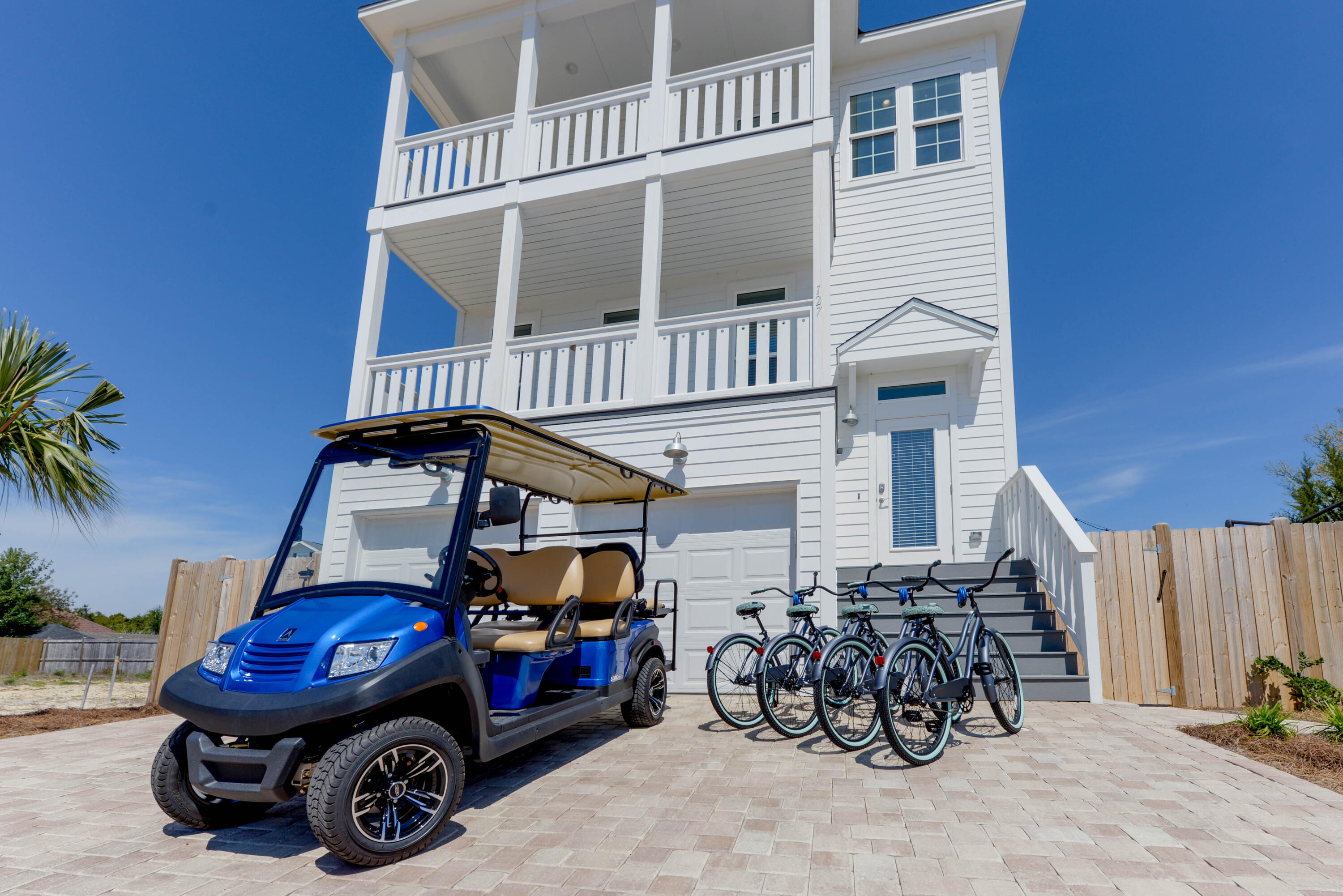 10 Blue Surf Lane Miramar Beach, FL 32550 - Photo 39 of 60 a car parked in front of a house with wooden fence