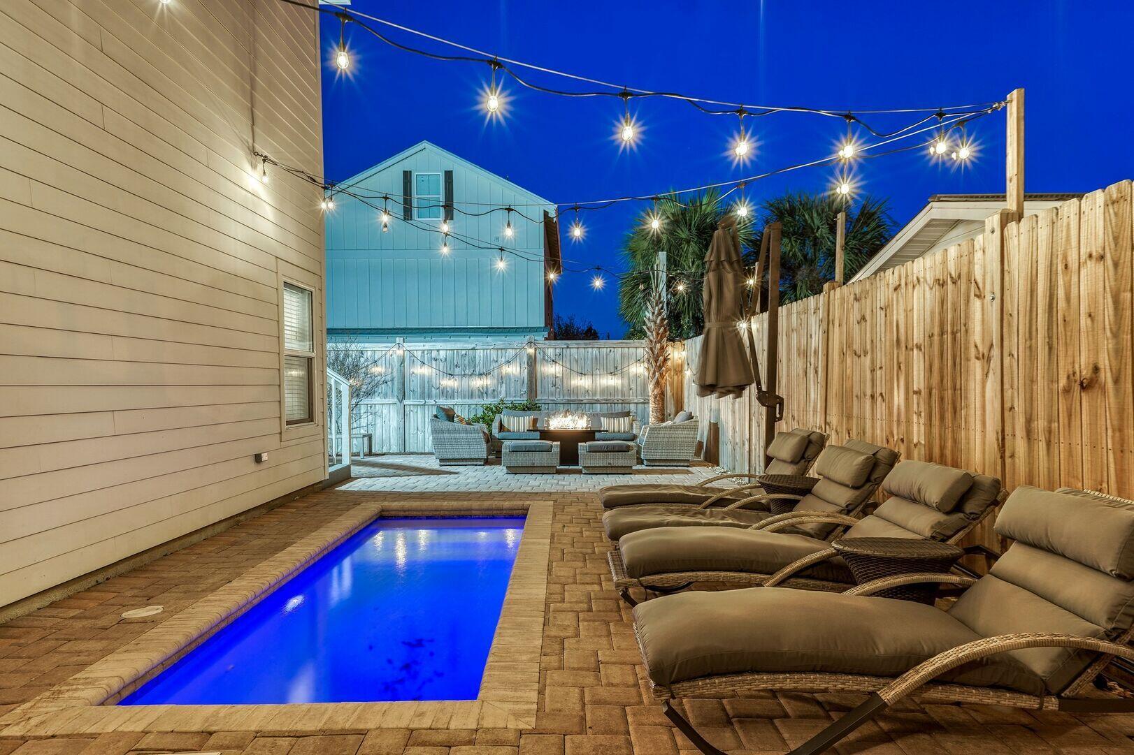 10 Blue Surf Lane Miramar Beach, FL 32550 - Photo 55 of 60 a kitchen with stainless steel appliances granite countertop a sink a stove and red cabinets