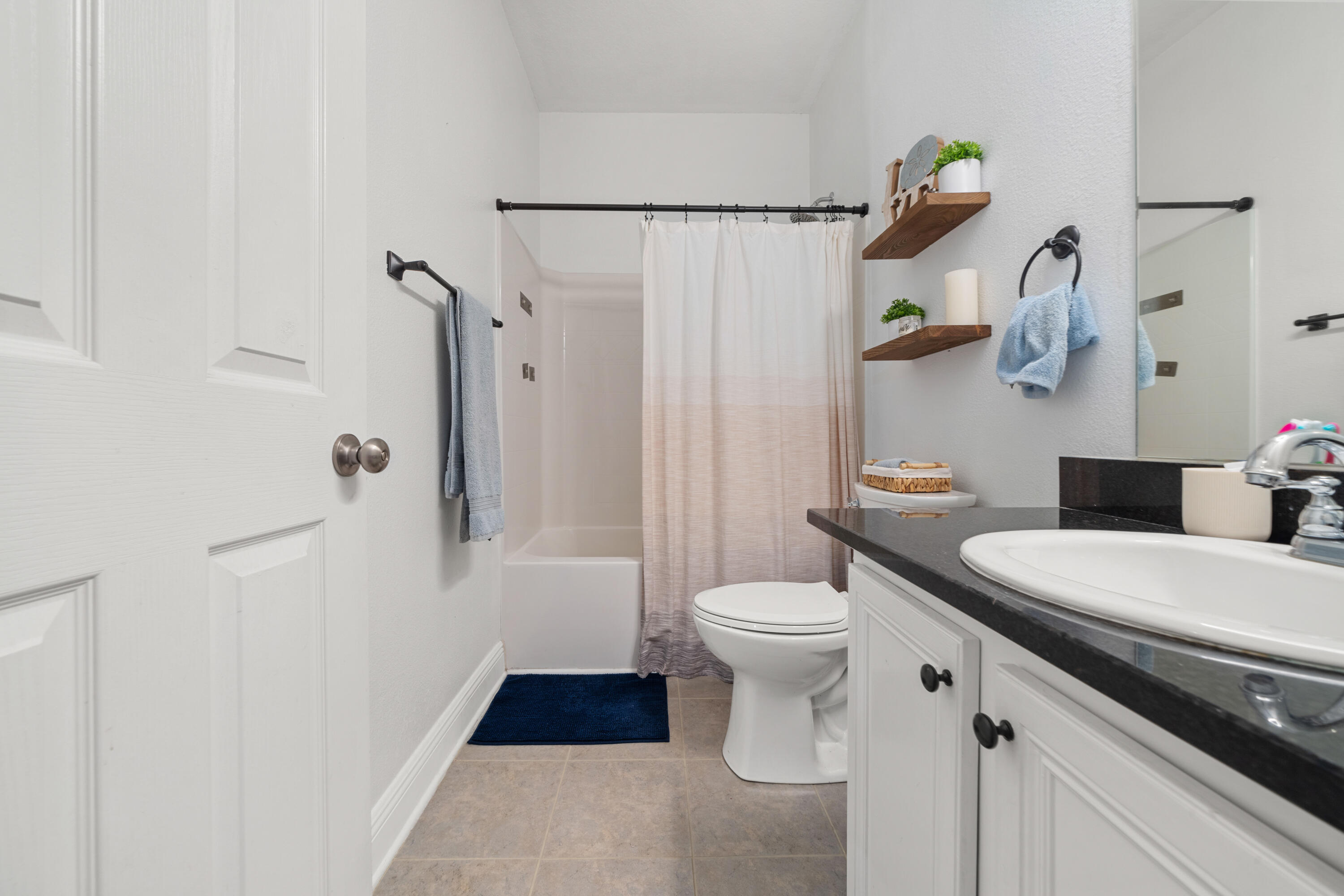 486 Fanny Ann Way Freeport, FL 32439 - Photo 12 of 58 a white toilet sitting next to a bathroom sink