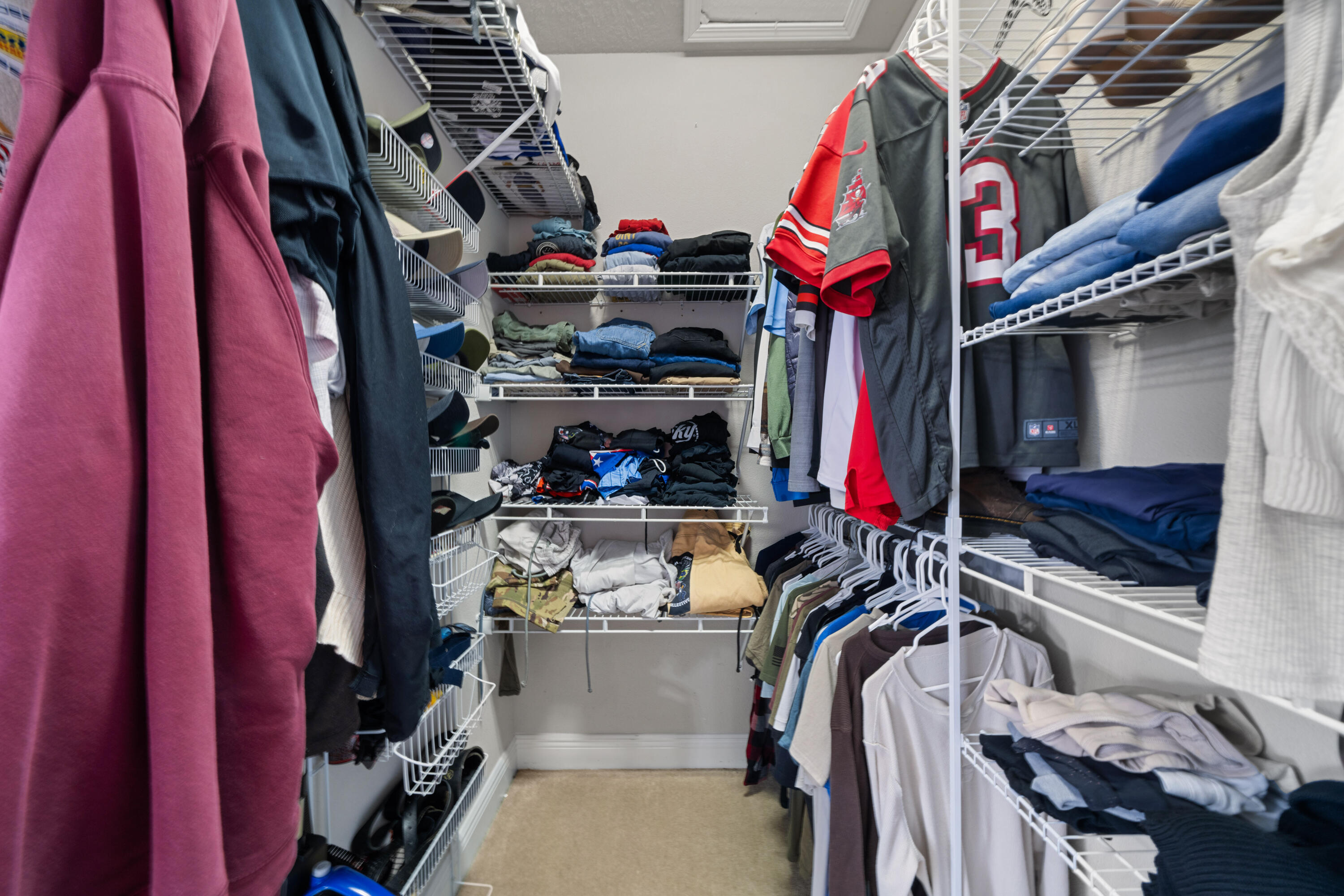 486 Fanny Ann Way Freeport, FL 32439 - Photo 17 of 58 a view of walk in closet with clothes and shoes