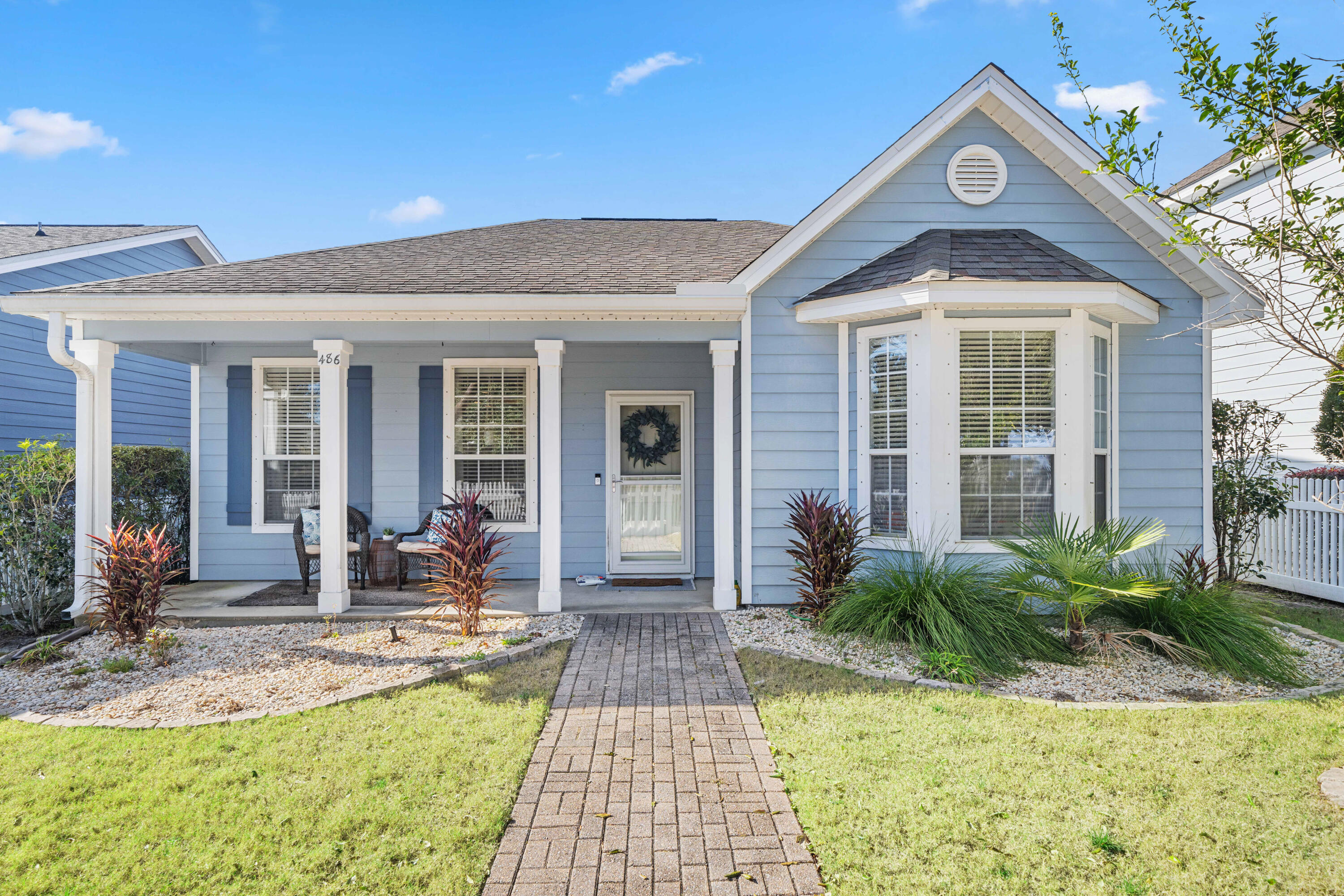486 Fanny Ann Way Freeport, FL 32439 - Photo 2 of 58 a front view of house with yard outdoor seating and barbeque oven
