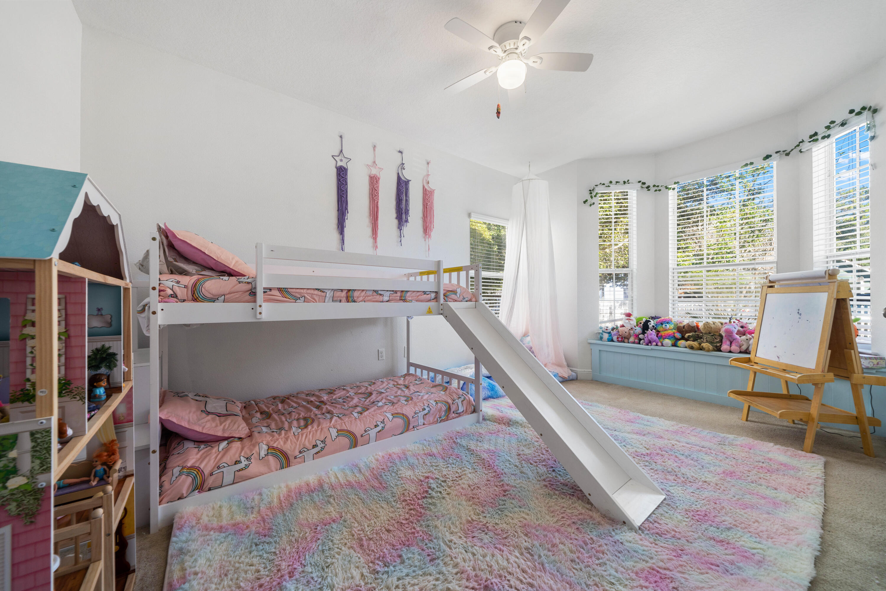 486 Fanny Ann Way Freeport, FL 32439 - Photo 25 of 58 a living room with a couch wooden floor and a large window