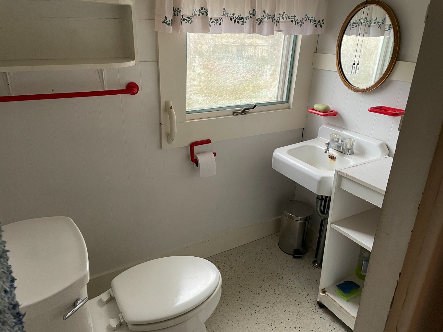 27 Pinehurst Road Edgartown, MA 02539 - Photo 4 of 6 a bathroom with a toilet a sink and a mirror