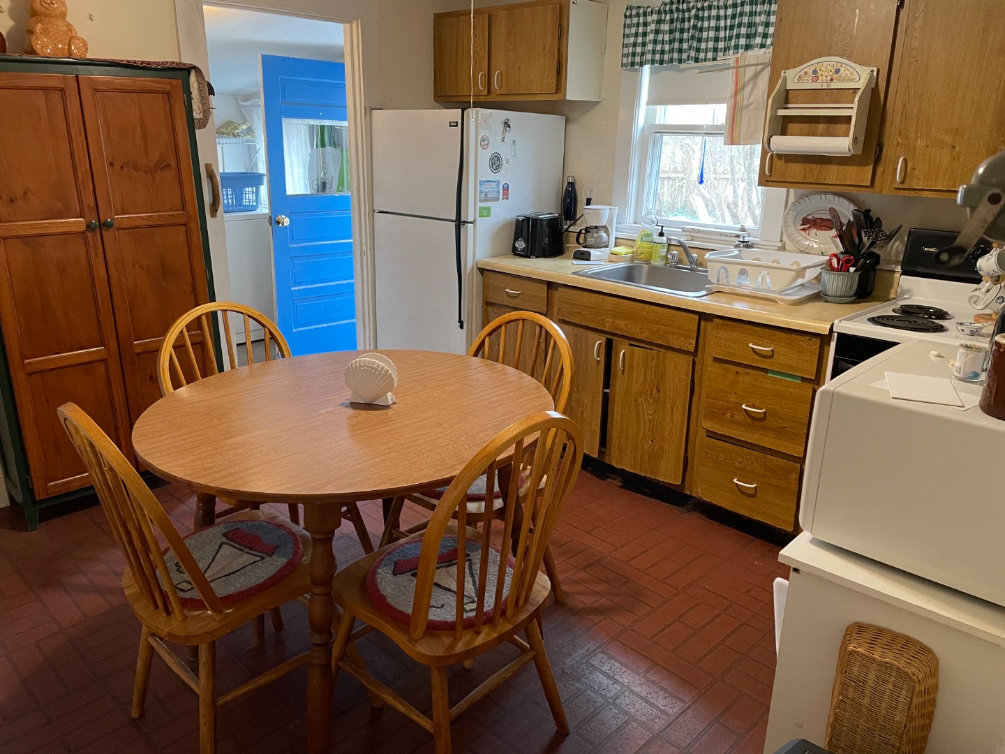 27 Pinehurst Road Edgartown, MA 02539 - Photo 6 of 6 a view of a kitchen with furniture and a refrigerator