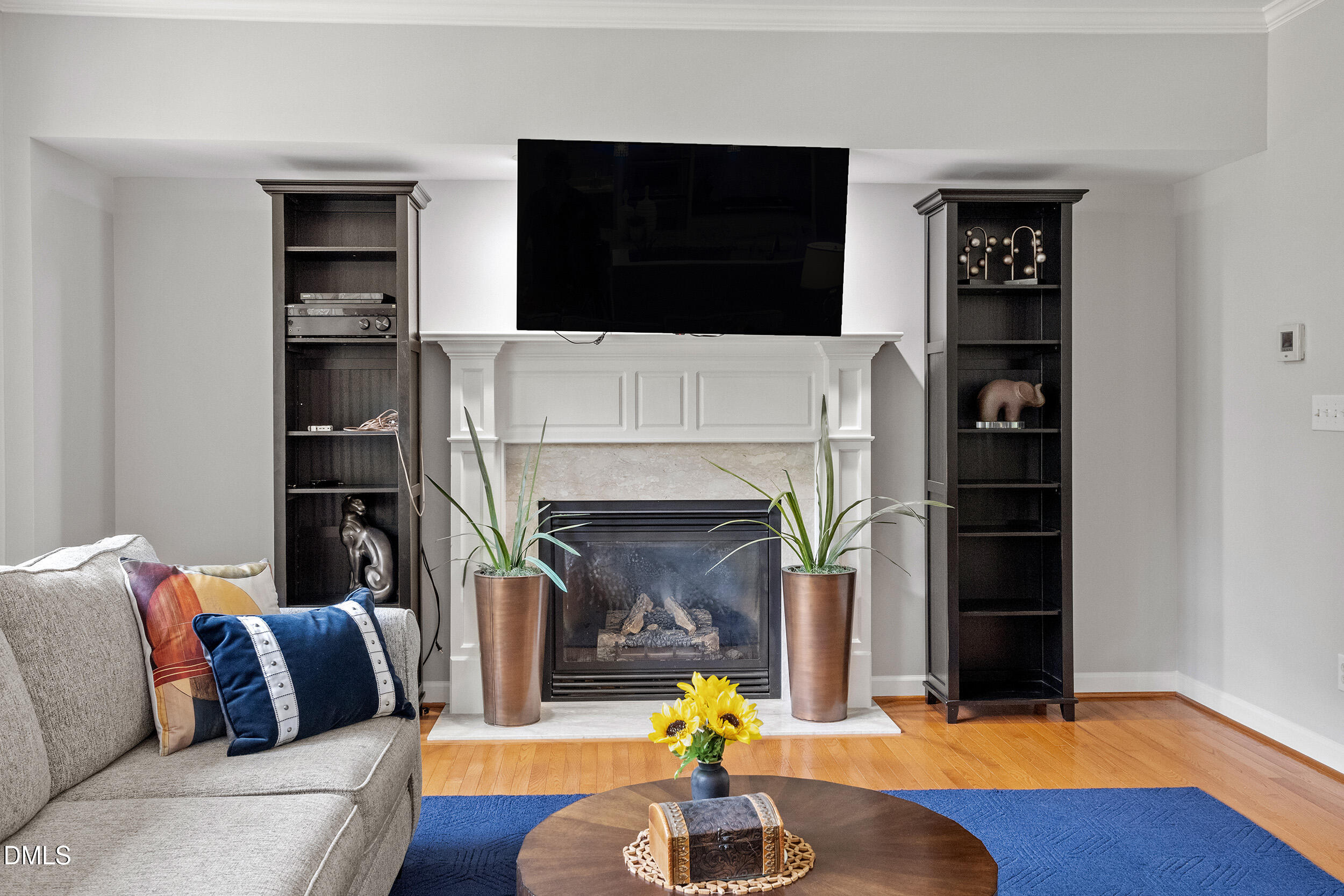 1019 Bianco Drive Raleigh, NC 27607 - Photo 9 of 29 a living room with furniture and a fireplace