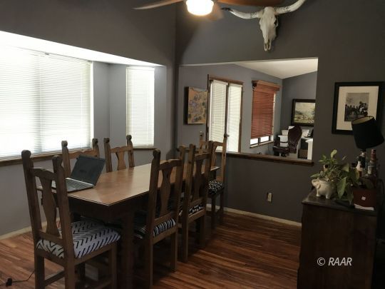 1009 Meadowview Lane Ridgecrest, CA 93555 - Photo 11 of 32 a view of a a dining room with furniture window and wooden floor