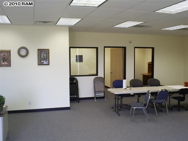 89 Ho'okele Street, Unit 104 Kahului, HI 96732 - Photo 2 of 3 a view of a livingroom with furniture and window