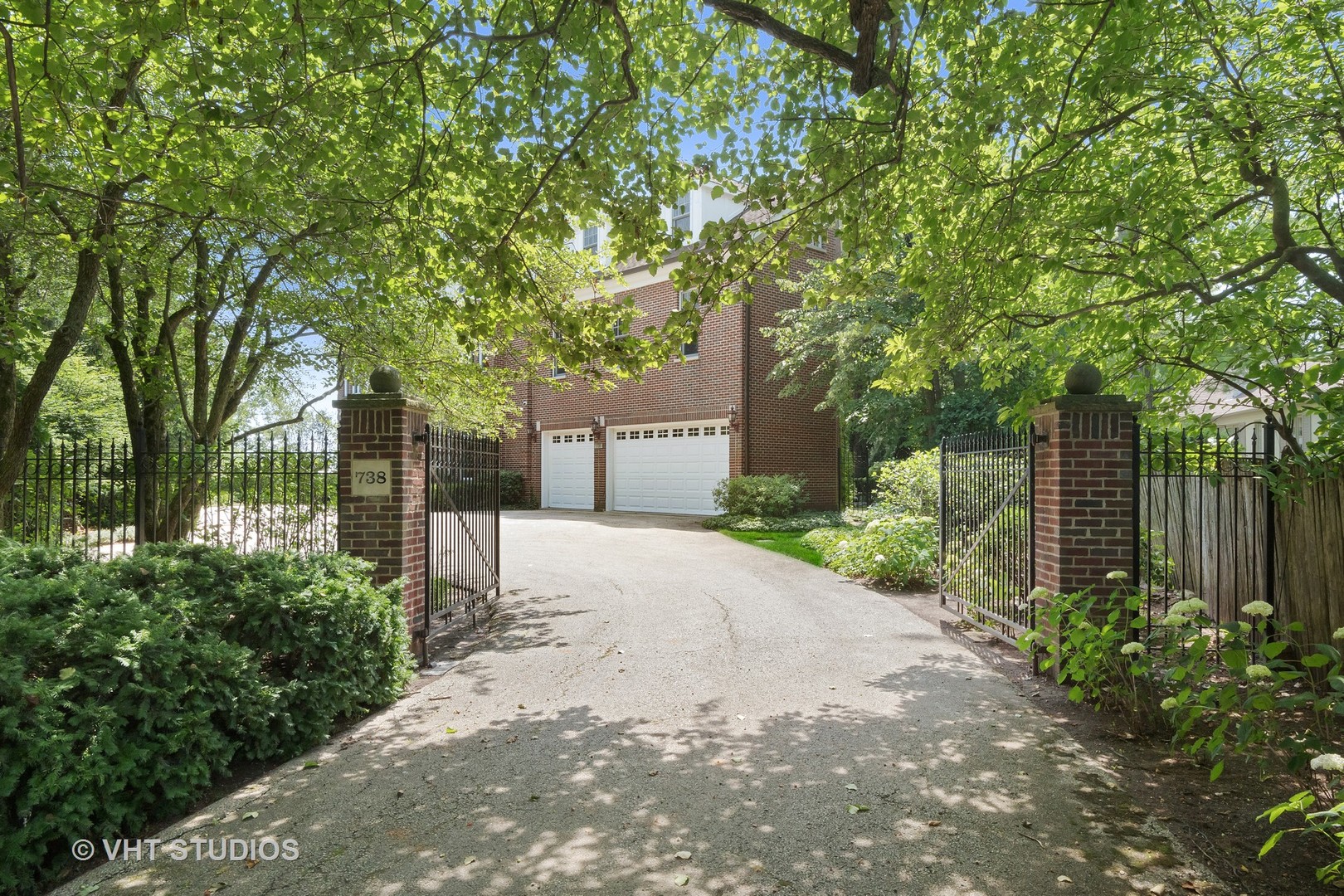 738 Tower Road Winnetka, IL 60093 - Photo 3 of 58 a front view of a house with a yard and a garage