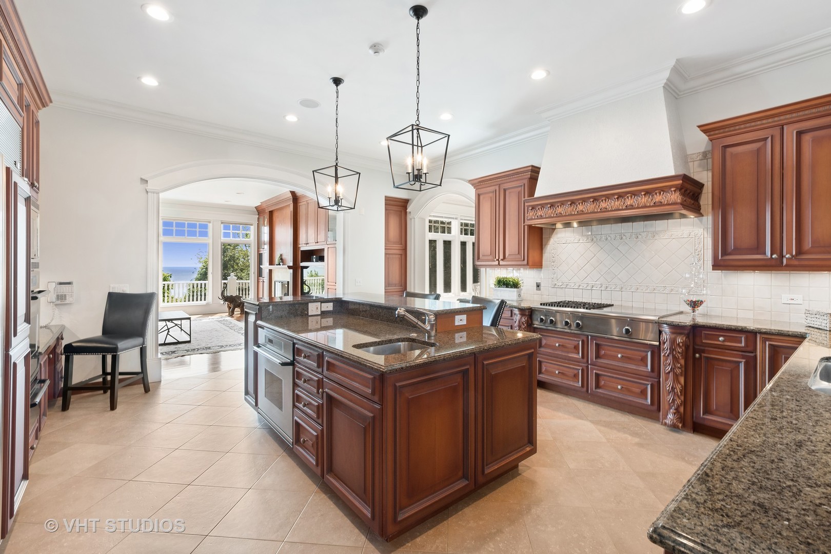 738 Tower Road Winnetka, IL 60093 - Photo 21 of 58 a kitchen with stainless steel appliances granite countertop a stove a sink dishwasher and a refrigerator