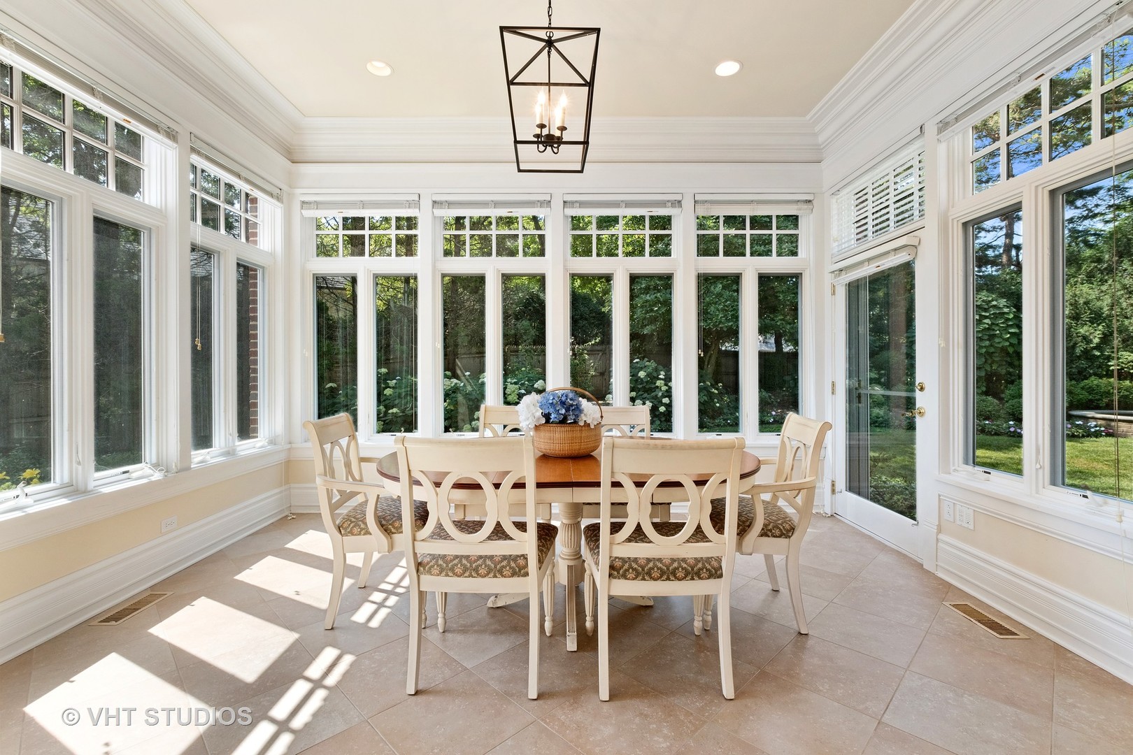 738 Tower Road Winnetka, IL 60093 - Photo 24 of 58 a dining room with furniture a chandelier and a rug
