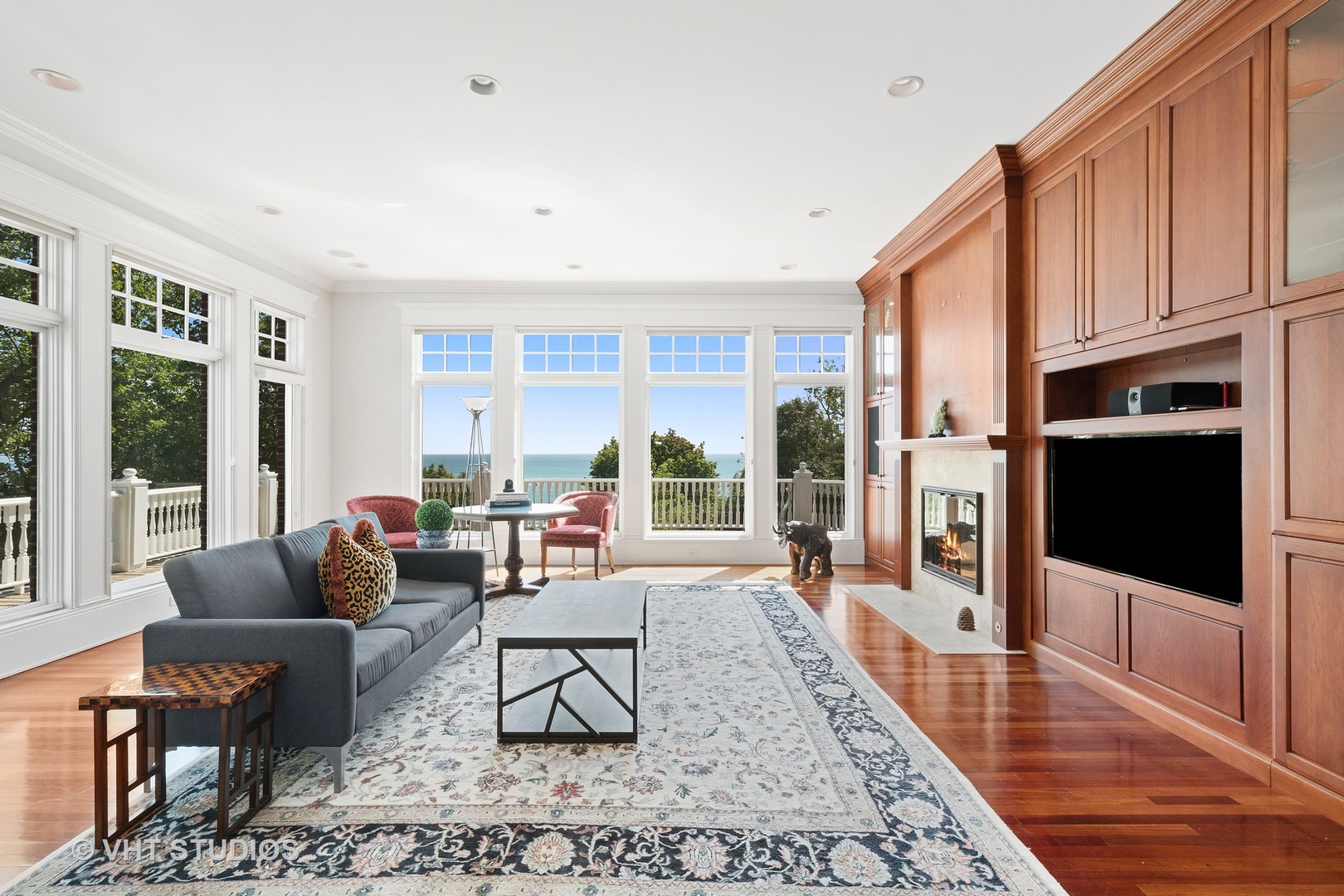 738 Tower Road Winnetka, IL 60093 - Photo 26 of 58 a living room with furniture wooden floor and a fireplace