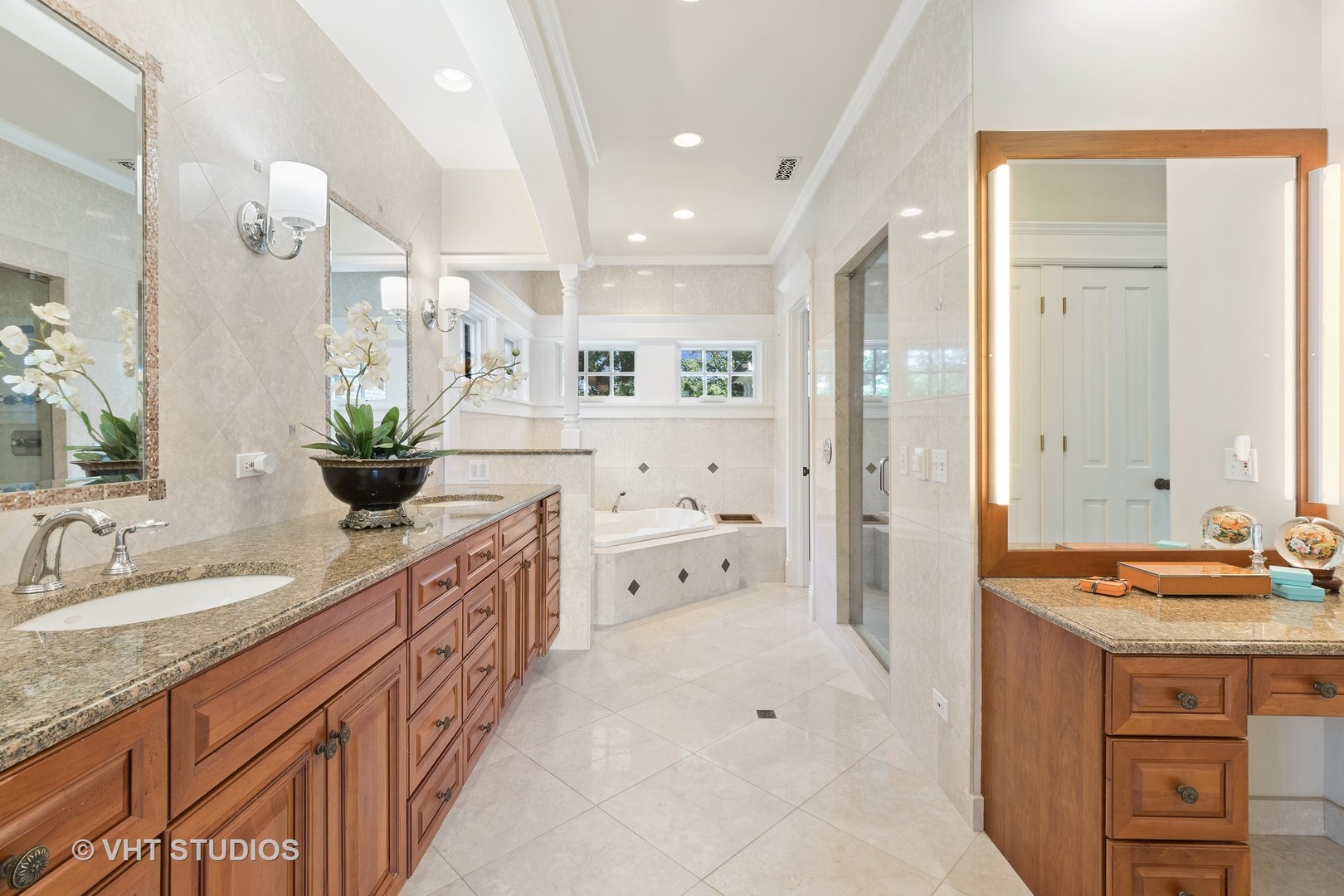 738 Tower Road Winnetka, IL 60093 - Photo 33 of 58 a spacious bathroom with a granite countertop double vanity sink a mirror and a