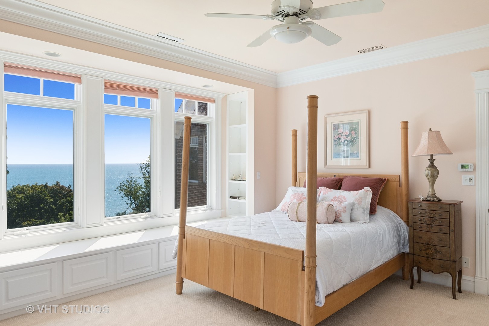 738 Tower Road Winnetka, IL 60093 - Photo 35 of 58 a bedroom with a large bed and a chandelier