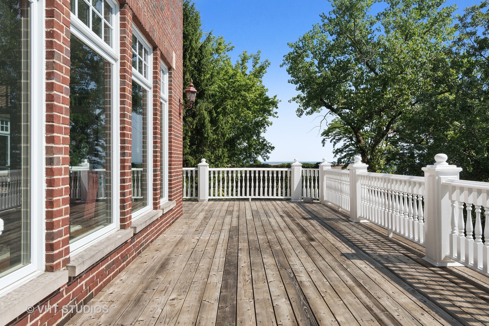 738 Tower Road Winnetka, IL 60093 - Photo 47 of 58 a view of a wooden deck with a yard