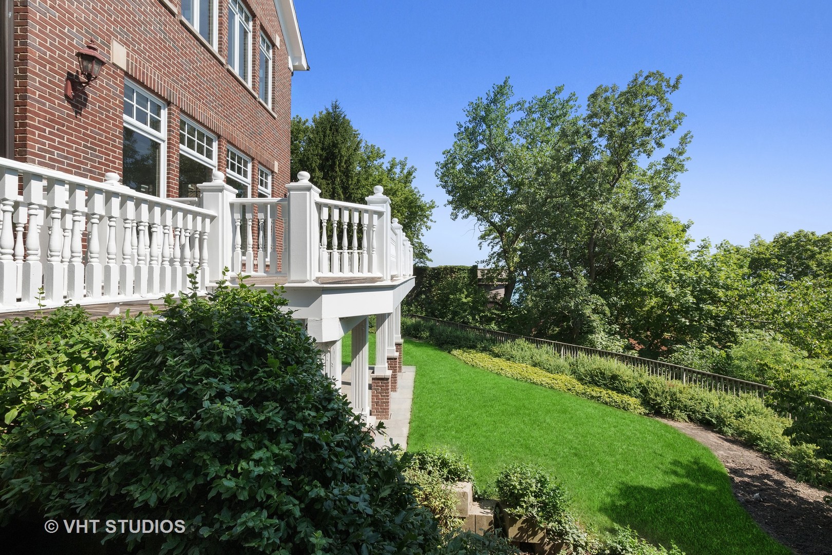 738 Tower Road Winnetka, IL 60093 - Photo 50 of 58 a view of a house with a yard and potted plants