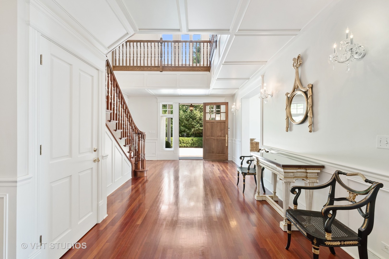 738 Tower Road Winnetka, IL 60093 - Photo 9 of 58 a view of a hallway with wooden floor and staircase