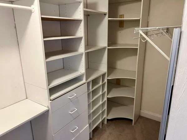 a view of an empty walk in closet