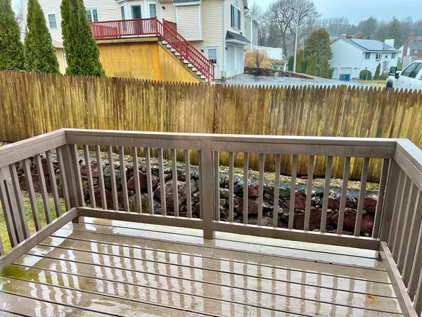 a view of a balcony with wooden floor