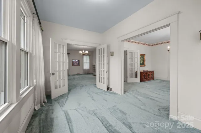 a view of a hallway with wooden shelves