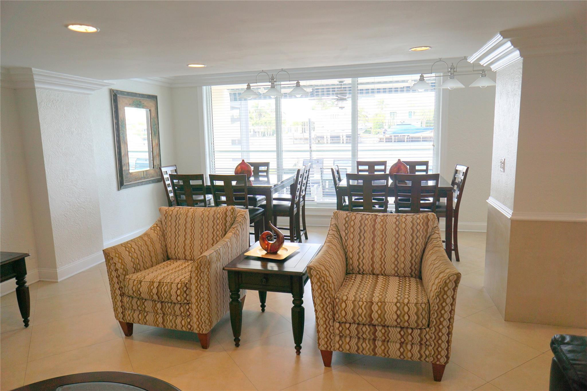 303 North Riverside Drive, Unit PH4 Pompano Beach, FL 33062 - Photo 47 of 52 a living room with furniture and a large window