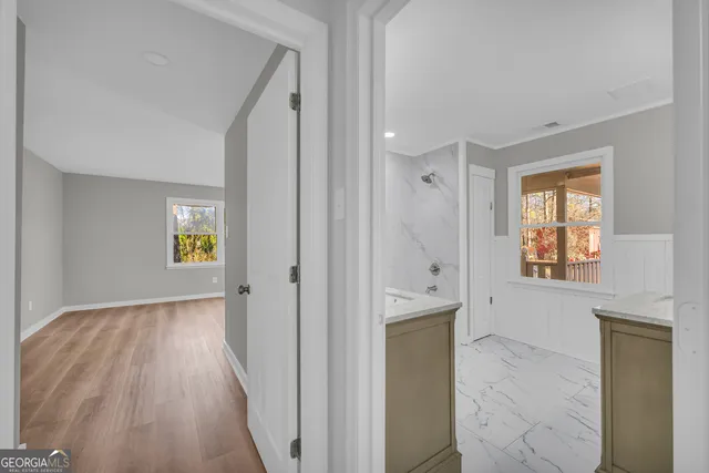 a view of hallway with natural light