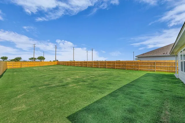 a view of an outdoor space and basketball court