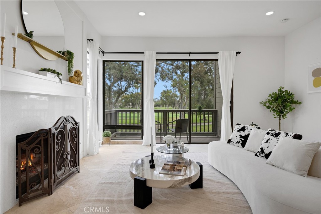 20 Nuevo, Unit 10 Irvine, CA 92612 - Photo 19 of 36 a living room with furniture and a large window