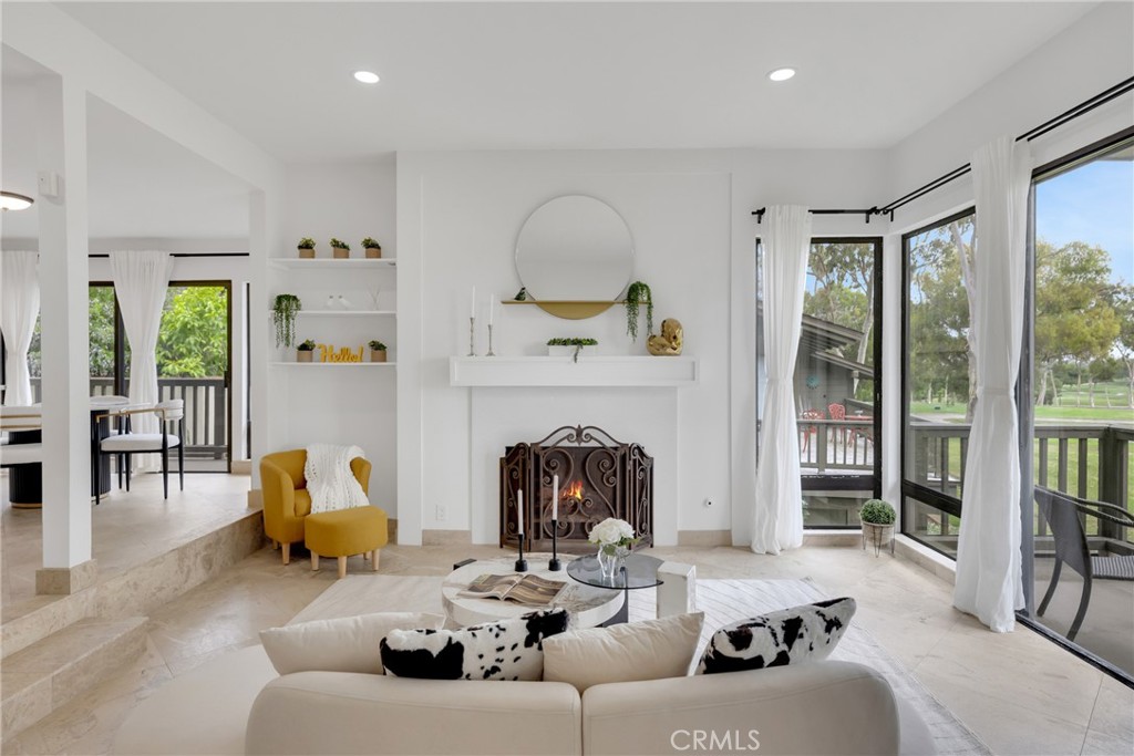 20 Nuevo, Unit 10 Irvine, CA 92612 - Photo 20 of 36 a living room with furniture and a fireplace