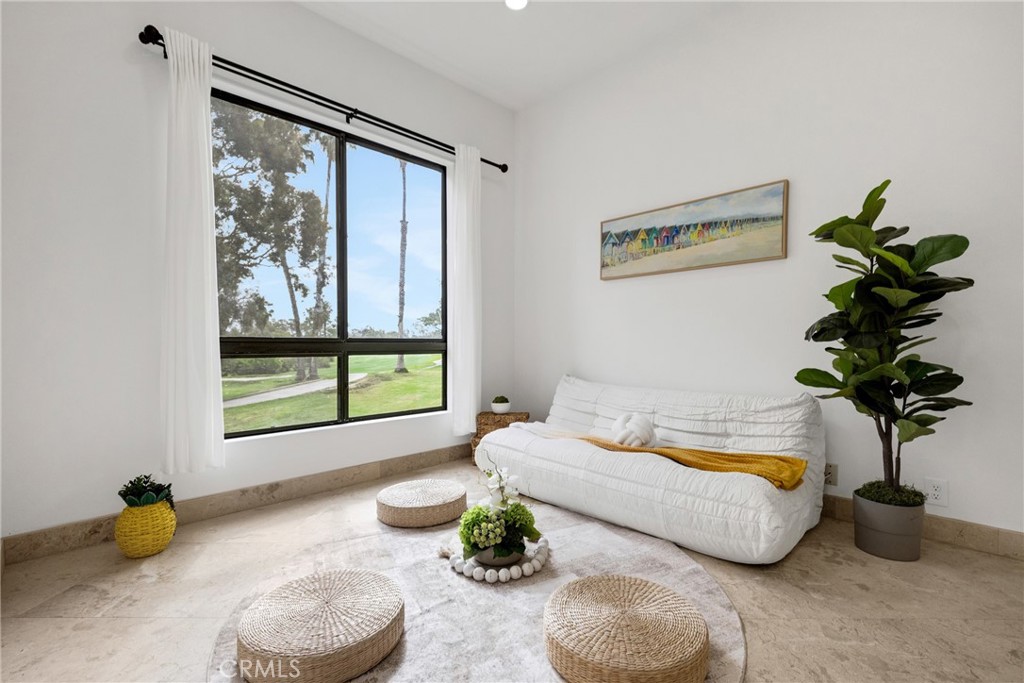 20 Nuevo, Unit 10 Irvine, CA 92612 - Photo 24 of 36 a bedroom with a bed and a window