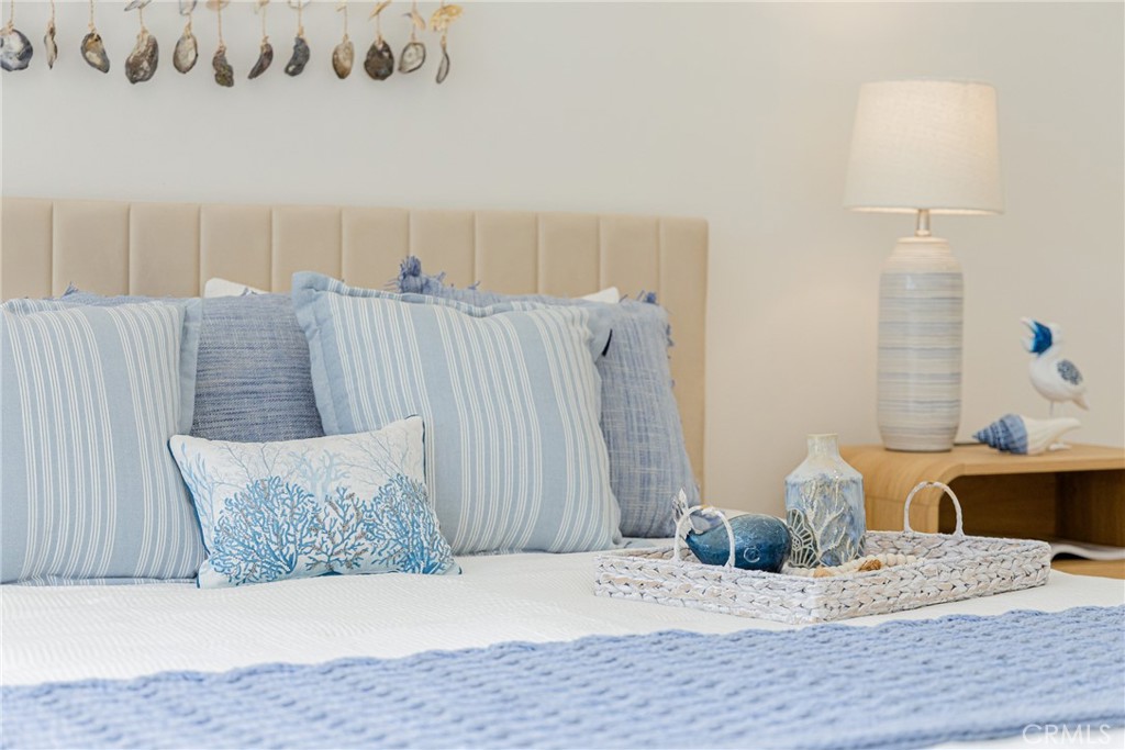 20 Nuevo, Unit 10 Irvine, CA 92612 - Photo 28 of 36 a bedroom with a bed and a couch