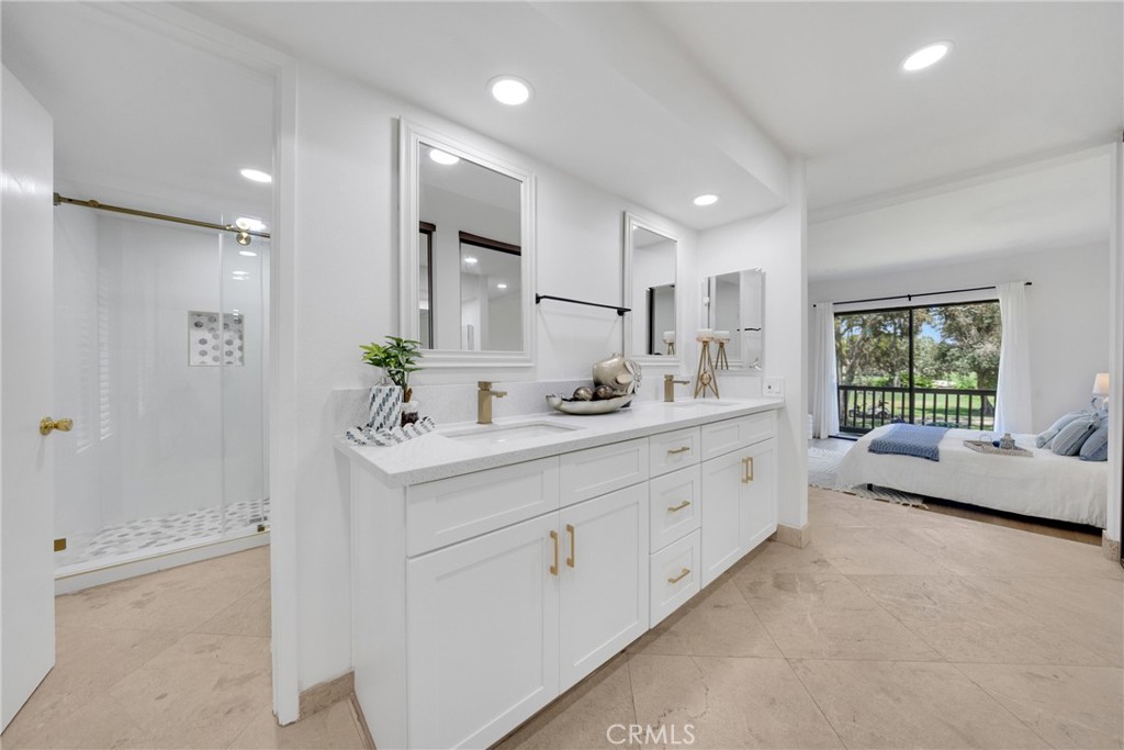 20 Nuevo, Unit 10 Irvine, CA 92612 - Photo 31 of 36 a bathroom with a double vanity sink mirror and double