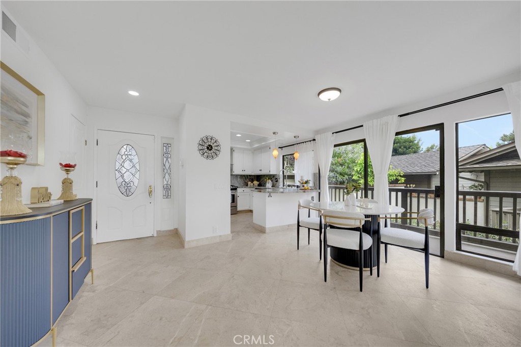20 Nuevo, Unit 10 Irvine, CA 92612 - Photo 5 of 36 a living room with furniture and a book shelf