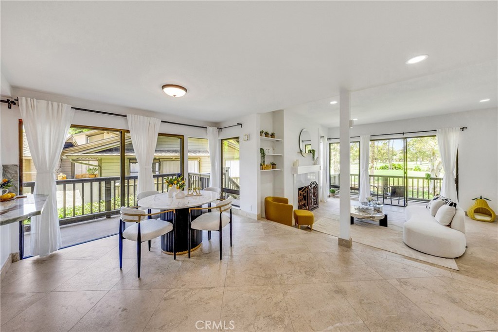 20 Nuevo, Unit 10 Irvine, CA 92612 - Photo 6 of 36 a living room with furniture and large windows