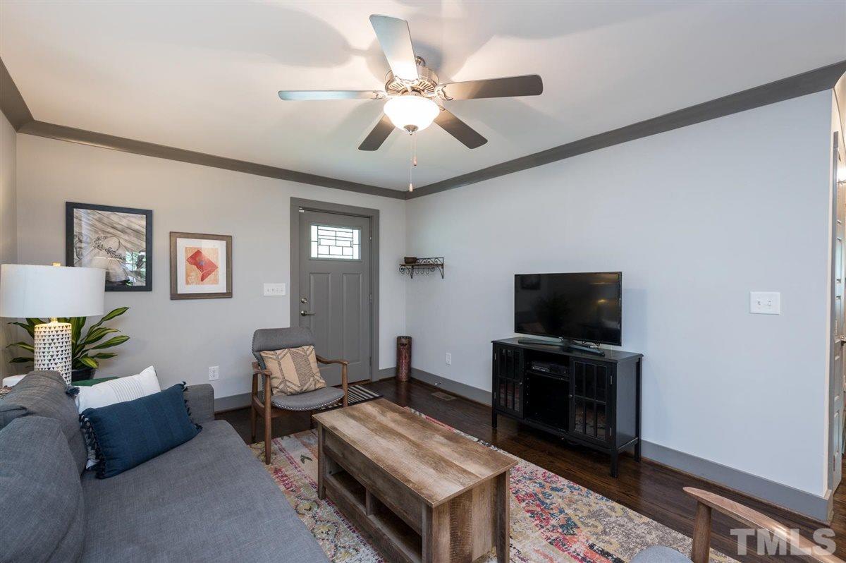 2446 Stevens Road Raleigh, NC 27610 - Photo 13 of 30 a living room with furniture and a flat screen tv