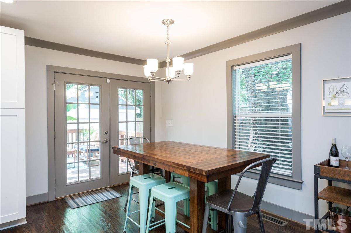 2446 Stevens Road Raleigh, NC 27610 - Photo 15 of 30 a view of a dining room with furniture wooden floor and chandelier