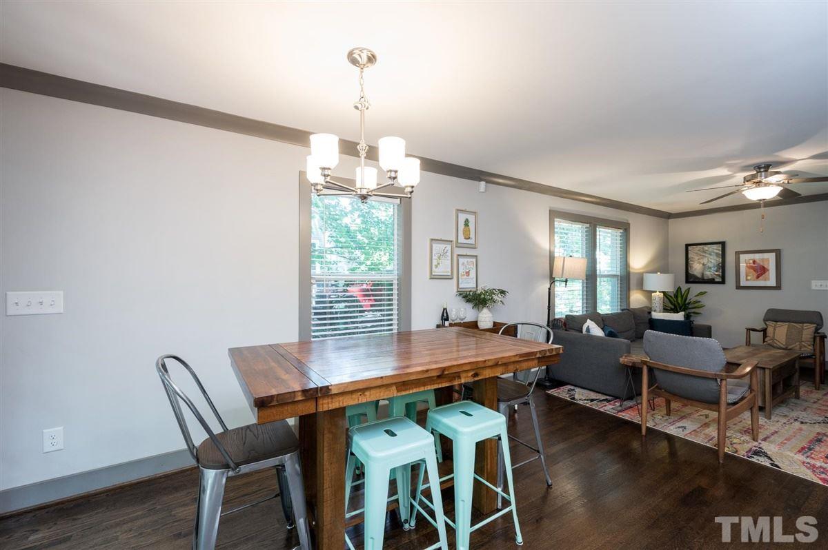 2446 Stevens Road Raleigh, NC 27610 - Photo 16 of 30 a view of a dining room with furniture window and wooden floor