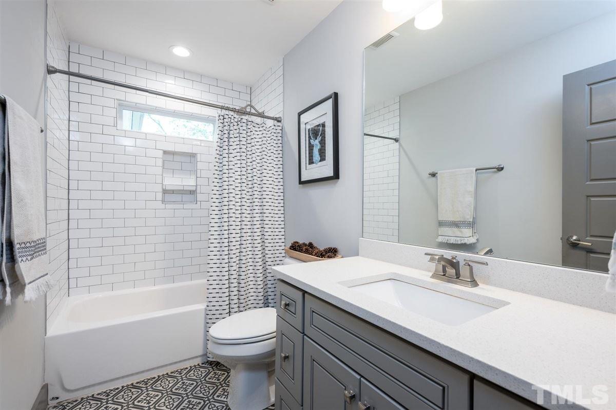 2446 Stevens Road Raleigh, NC 27610 - Photo 26 of 30 a bathroom with a sink toilet and shower
