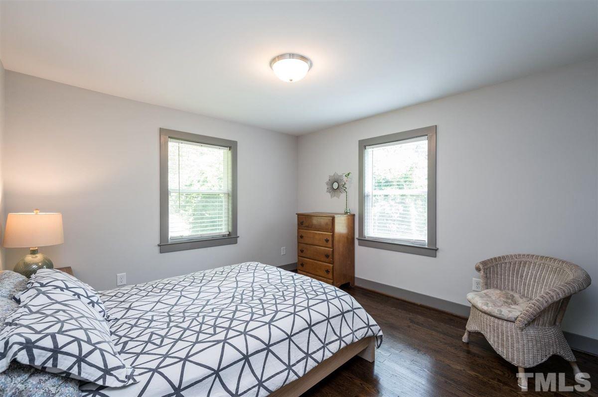 2446 Stevens Road Raleigh, NC 27610 - Photo 27 of 30 a bedroom with a bed and wooden floor