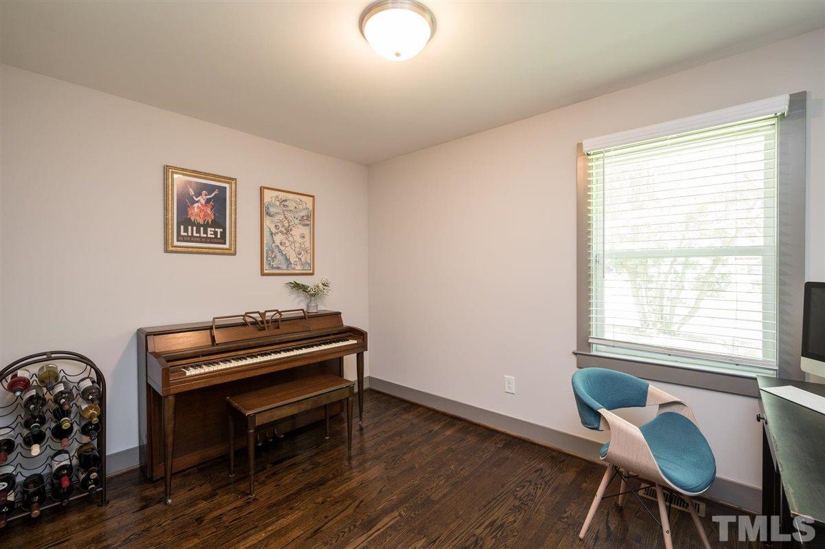 2446 Stevens Road Raleigh, NC 27610 - Photo 28 of 30 a view of a workspace with furniture and a window