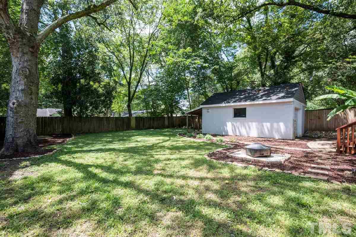 2446 Stevens Road Raleigh, NC 27610 - Photo 9 of 30 a view of a backyard with a tree