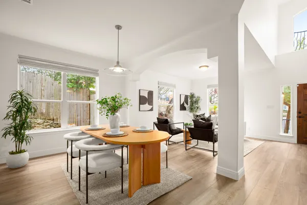 a dining room with furniture window wooden floor