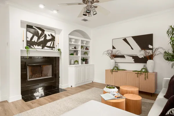 a living room with furniture fireplace and flat screen tv