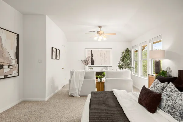 a bedroom with bed and night stand