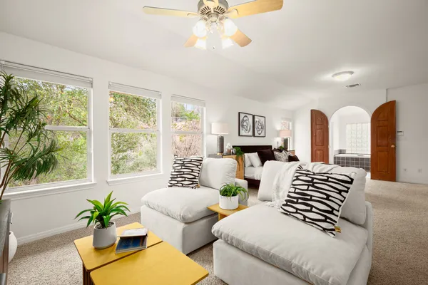 a bedroom with bed and window