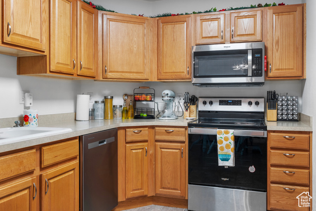 8196 North Cedar Springs Road, Unit 2 Eagle Mountain, UT 84005 - Photo 6 of 22 Kitchen featuring stainless steel appliances and light countertops